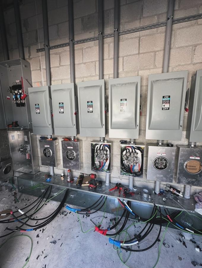 Bank of safety switches and meter cans during installation